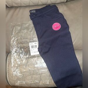 Two pair of girls uniform jeggings